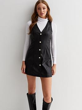New Look Leather-Look Faux Pearl Button Front Pinafore Dress - Black